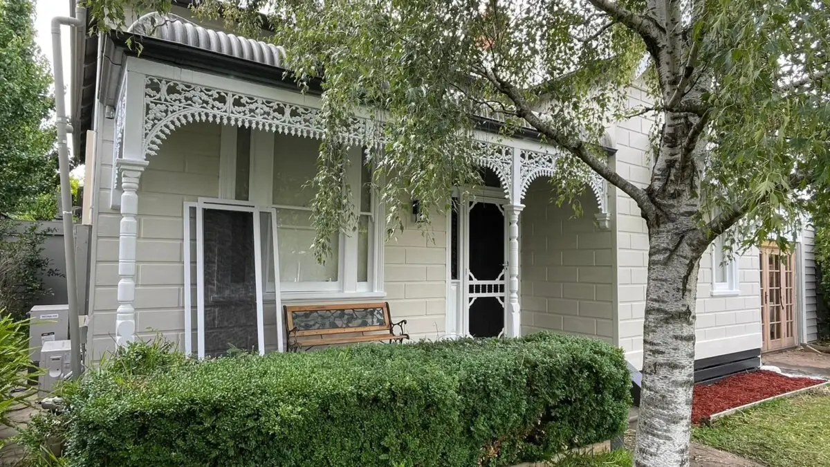 Weatherboard house after complete exterior painting.